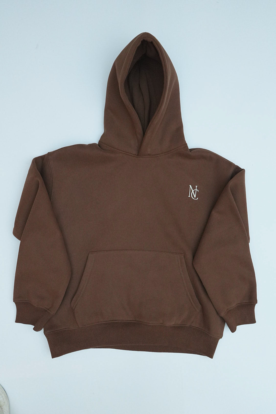 Kid's Mini & Me's - Butter Soft Hoodie in chocolate-brown with a kangaroo pocket and NC logo, designed for a cozy, oversized fit.