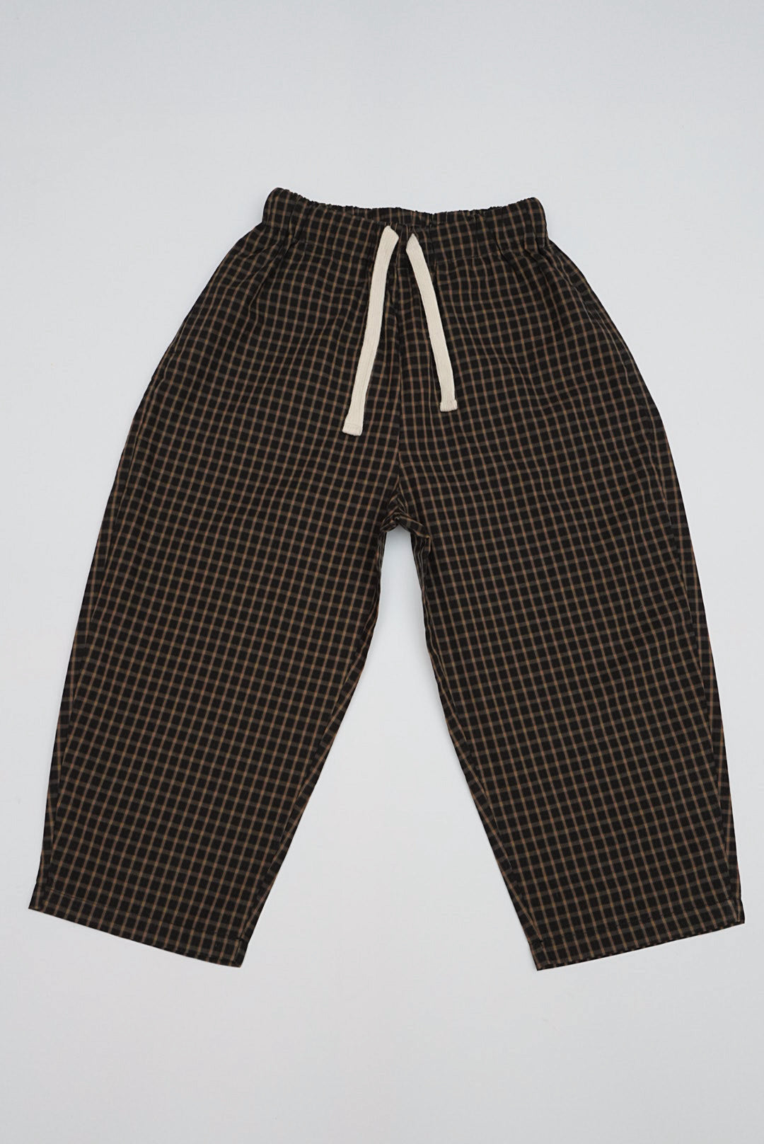 Brown Gingham Trousers with relaxed fit, ankle-length design, elastic waistband, and off-white drawstring, featuring a small grid pattern ideal for casual wear.