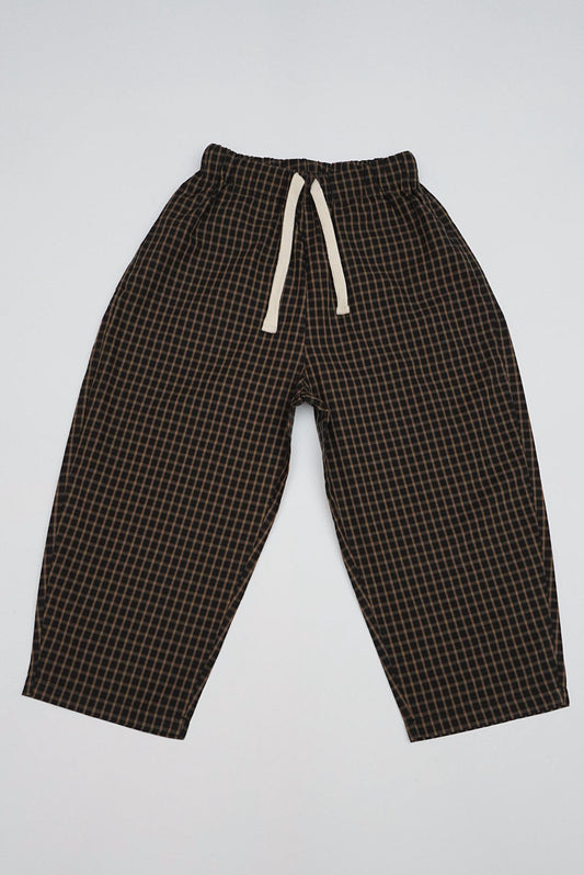 Brown Gingham Trousers with relaxed fit, ankle-length design, elastic waistband, and off-white drawstring, featuring a small grid pattern ideal for casual wear.