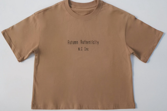 Autumn Authenticity Tee with Autumn Authenticity and N.C Inc printed on chest; relaxed fit, 100% cotton, ideal for everyday wear.