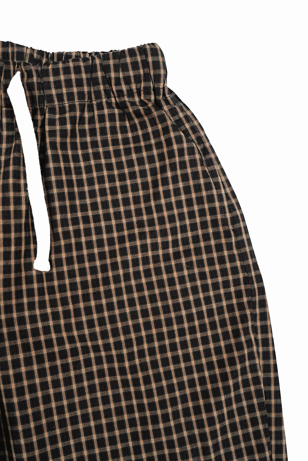 Brown Gingham Trousers featuring a small black and tan plaid pattern, with an elastic waistband and white drawstring, offer a relaxed, wide-leg fit.