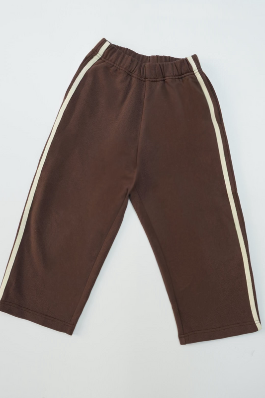 Heavy Weight Comfort Trackies laid flat, showcasing an elastic waistband and cream stripe on each leg, designed for everyday wear with a relaxed fit.